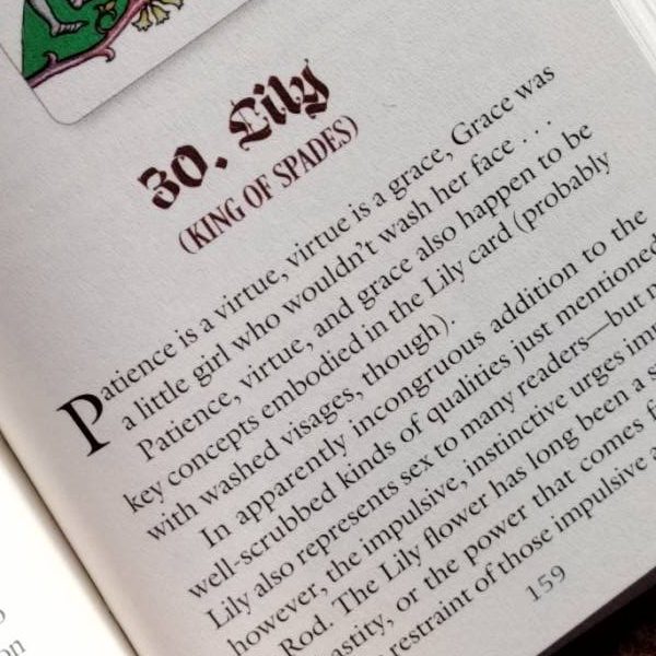 Sample page from the Marginal Lenormand companion book. Card 30 - Lily. Published by Red Feather. Book by Anastasia Kashian with foreword by Caitlin Matthews